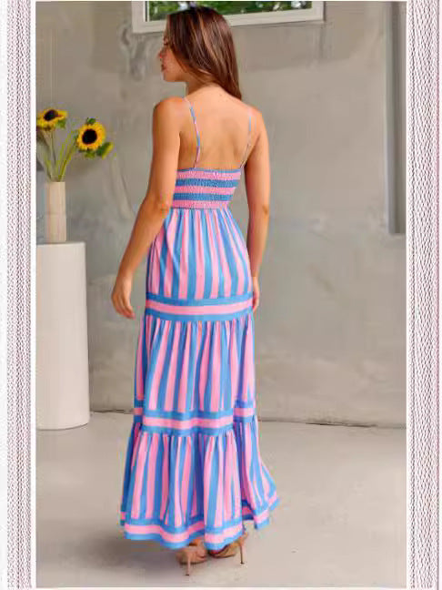 Robe longue rayée dos nu avec poches, idéale pour la plage.